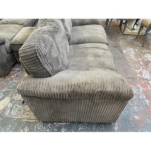 192 - A modern grey fabric upholstered three seater sofa - approx. 83cm high x 210cm wide x 94cm deep