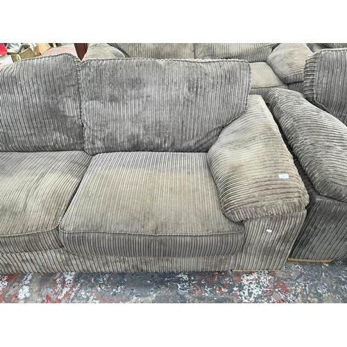 192 - A modern grey fabric upholstered three seater sofa - approx. 83cm high x 210cm wide x 94cm deep