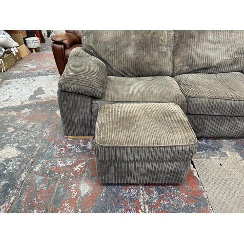 193 - A modern grey fabric upholstered four piece lounge suite comprising three seater sofa, armchair and ... 