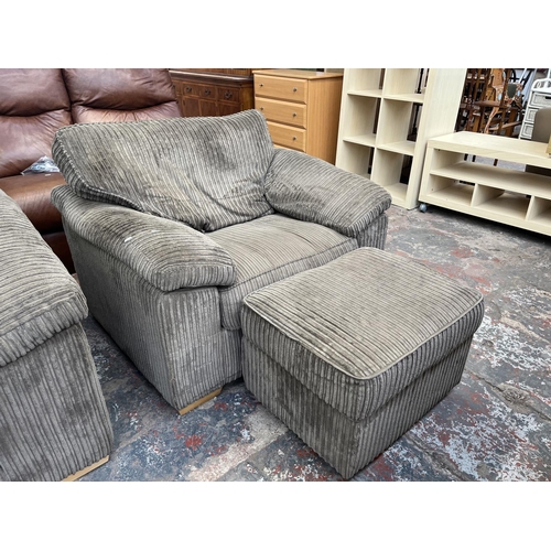 193 - A modern grey fabric upholstered four piece lounge suite comprising three seater sofa, armchair and ... 