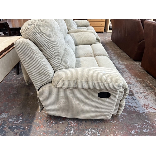 195 - Two modern beige fabric upholstered reclining two seater sofas - approx. 100cm high x 157cm wide x 9... 