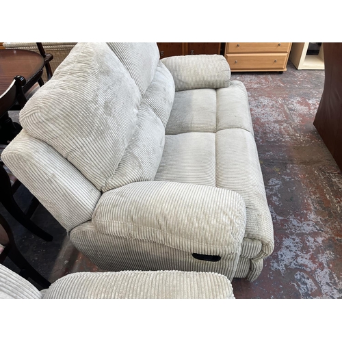 195 - Two modern beige fabric upholstered reclining two seater sofas - approx. 100cm high x 157cm wide x 9... 