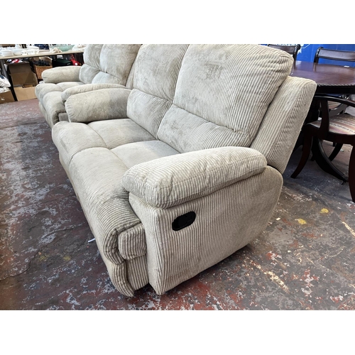 195 - Two modern beige fabric upholstered reclining two seater sofas - approx. 100cm high x 157cm wide x 9... 