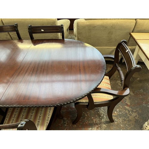 197 - A mahogany twin pedestal extending dining table and six chairs - approx. 77cm high x 93cm wide x 200... 