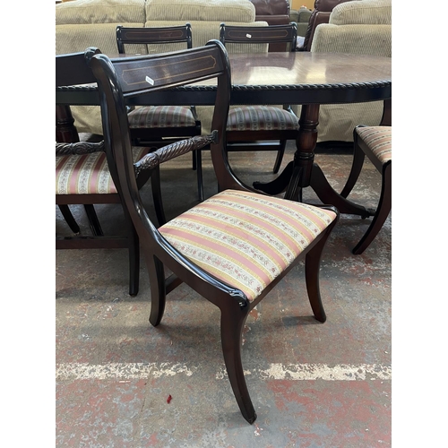 197 - A mahogany twin pedestal extending dining table and six chairs - approx. 77cm high x 93cm wide x 200... 