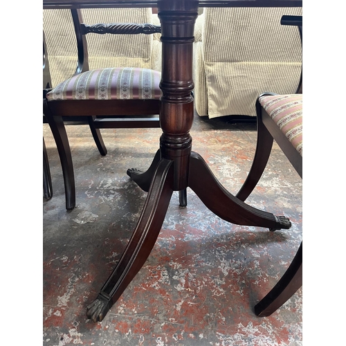 197 - A mahogany twin pedestal extending dining table and six chairs - approx. 77cm high x 93cm wide x 200... 