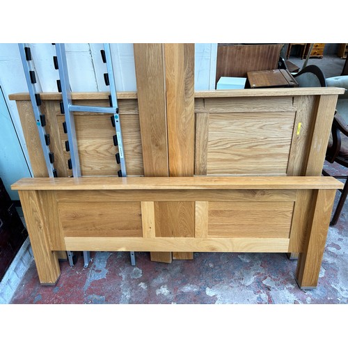 57 - A Furniture Village oak king size bed frame