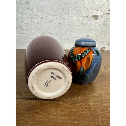 230 - Two pieces of studio pottery, one Alan Clarke vase - approx. 27cm high and one Poole Pottery jar and... 