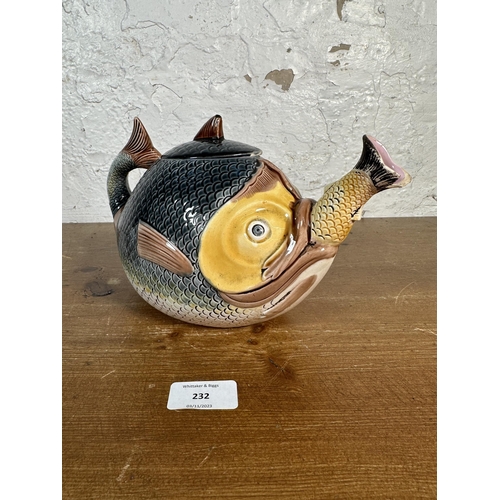 232 - A 19th century Majolica swallowing fish teapot - approx. 19cm high x 26cm long