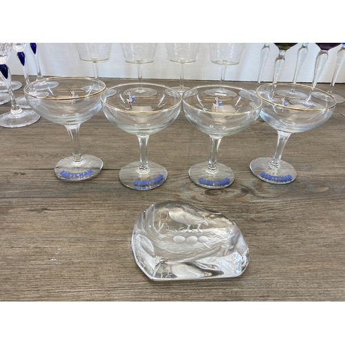 298 - A collection of glassware to include Edinburgh Crystal cut glass decanter, clear and blue cut glass ... 