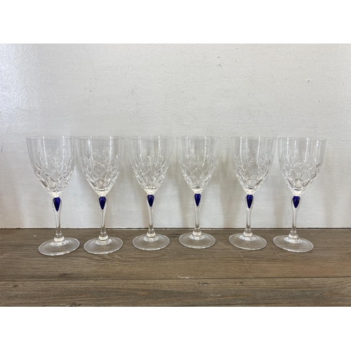 298 - A collection of glassware to include Edinburgh Crystal cut glass decanter, clear and blue cut glass ... 