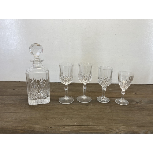 298 - A collection of glassware to include Edinburgh Crystal cut glass decanter, clear and blue cut glass ... 