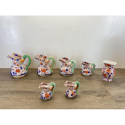 304 - Seven Imari pattern items, five Mason's Ironstone graduating jugs, one Ringtons jug and one vase