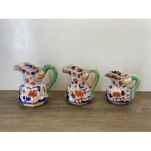 304 - Seven Imari pattern items, five Mason's Ironstone graduating jugs, one Ringtons jug and one vase