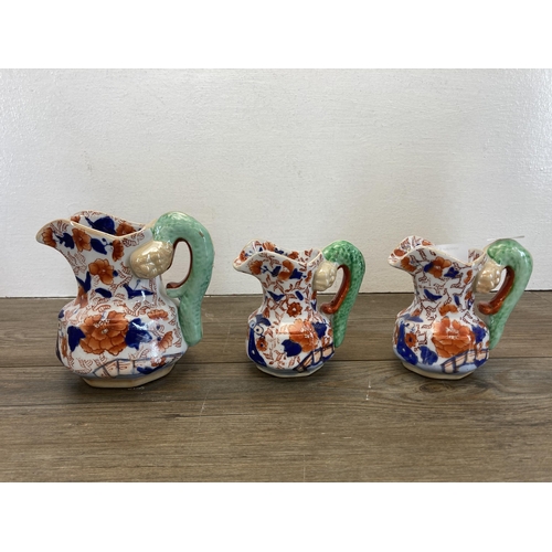 304 - Seven Imari pattern items, five Mason's Ironstone graduating jugs, one Ringtons jug and one vase