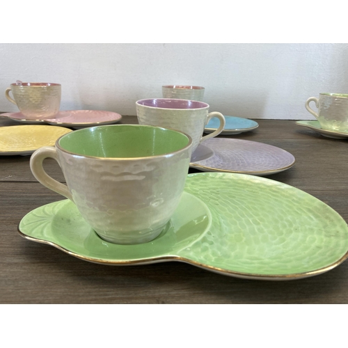 308 - Nine Maling Harlequin cups and saucers