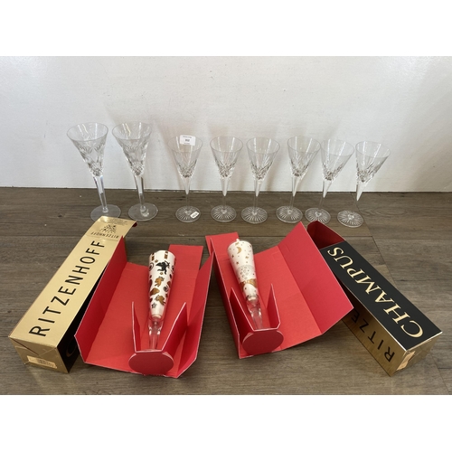 312 - Ten cut glass champagne flutes, six Royal Doulton, two Waterford Crystal and two boxed Ritzenhoff