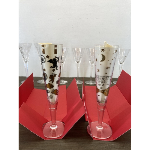 312 - Ten cut glass champagne flutes, six Royal Doulton, two Waterford Crystal and two boxed Ritzenhoff