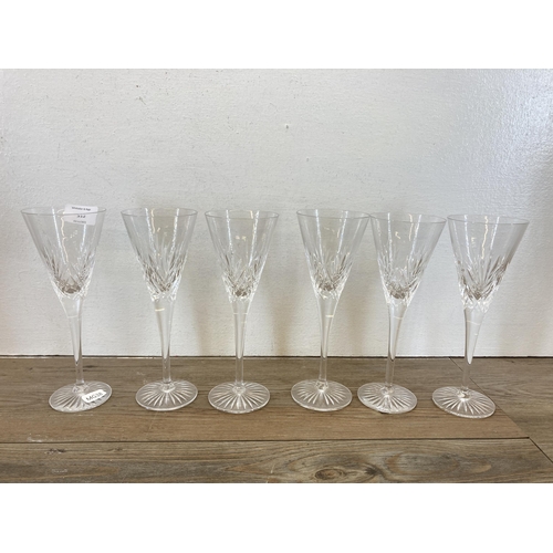 312 - Ten cut glass champagne flutes, six Royal Doulton, two Waterford Crystal and two boxed Ritzenhoff