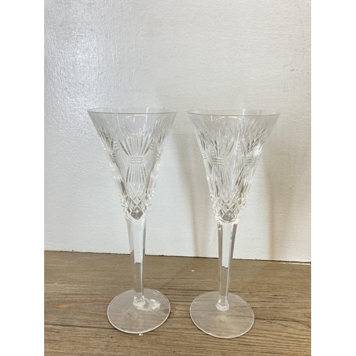 312 - Ten cut glass champagne flutes, six Royal Doulton, two Waterford Crystal and two boxed Ritzenhoff