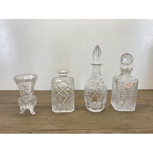 316 - Four pieces of cut crystal glassware, two Royal Doulton decanters and two others