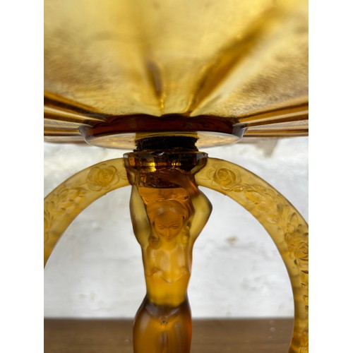 275 - An Art Deco style amber glass figural centerpiece pedestal bowl - approx. 27cm high x 25cm in diamet... 