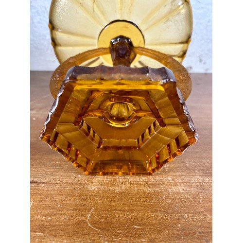 275 - An Art Deco style amber glass figural centerpiece pedestal bowl - approx. 27cm high x 25cm in diamet... 