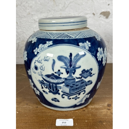 252 - A Chinese blue and white ginger jar and cover - approx. 24cm high