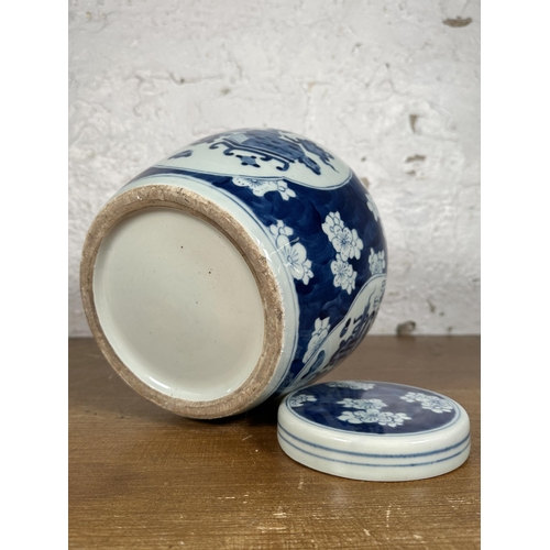 252 - A Chinese blue and white ginger jar and cover - approx. 24cm high