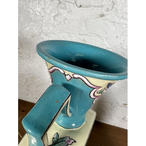 262 - A pair of hand painted pottery two handled vases with bird and foliate design - approx. 32cm high