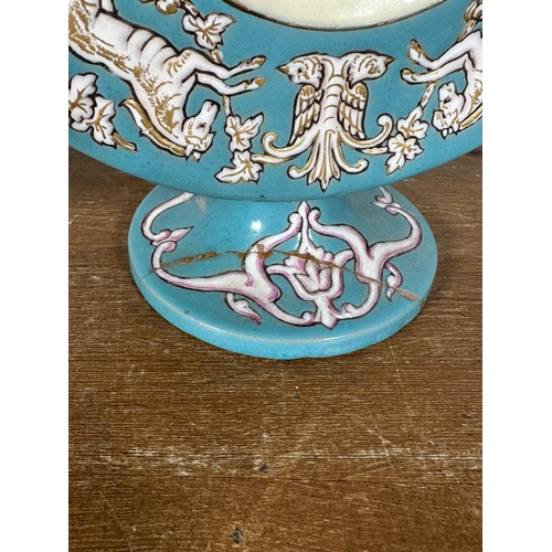 262 - A pair of hand painted pottery two handled vases with bird and foliate design - approx. 32cm high