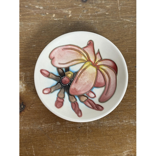 271 - A Moorcroft pottery Frangipani pattern trinket dish - approx. 11.5cm in diameter