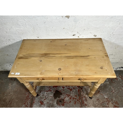 93 - A Victorian pine two drawer wash stand/console table - approx. 73cm high x 95cm wide x 52cm deep