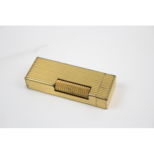 2342 - A Dunhill Rollagas gold plated cigarette lighter