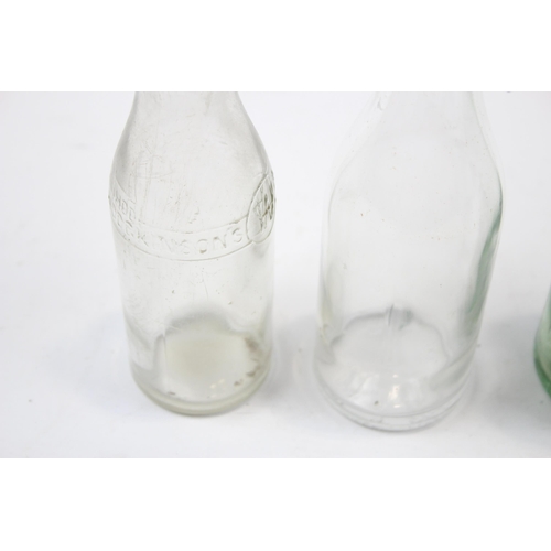 285 - Six vintage glass bottles to include lemonade, Urmston Bros Tonge etc.