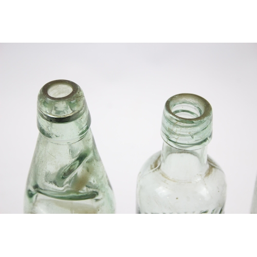 285 - Six vintage glass bottles to include lemonade, Urmston Bros Tonge etc.