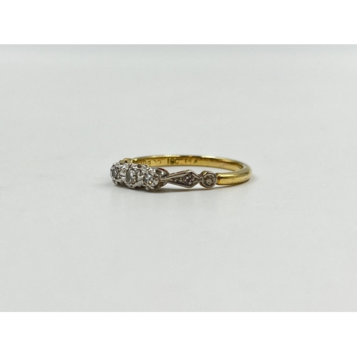 2151 - An 18ct gold and platinum diamond trilogy ring with diamond shoulders - approx. gross weight 3g