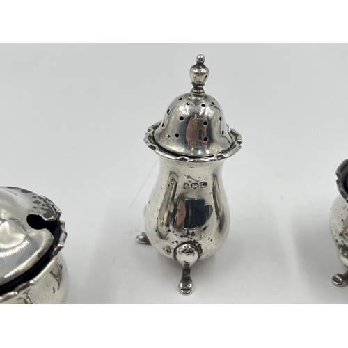 2277 - An Adie Brothers Ltd hallmarked Birmingham silver three piece cruet set, dated 1922 and two .925 sil... 