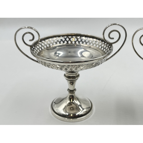 2283 - A pair of Edwardian Walker & Hall hallmarked Sheffield silver pierced twin handled pedestal dishes, ... 