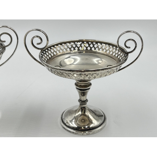 2283 - A pair of Edwardian Walker & Hall hallmarked Sheffield silver pierced twin handled pedestal dishes, ... 