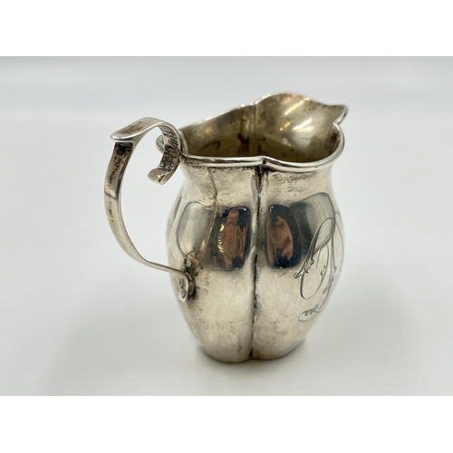 2297 - A George V John Rose hallmarked Birmingham silver cream jug, dated 1911 - approx. gross weight 76g a... 