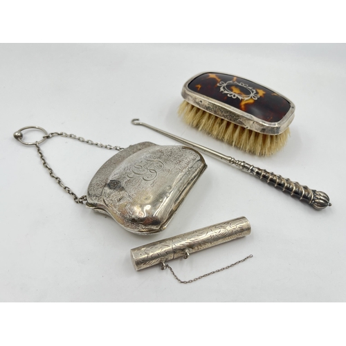 2298 - Four hallmarked sterling silver vanity items to include brush, purse etc. - approx. gross weight 133... 