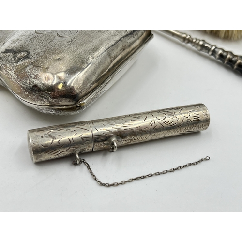 2298 - Four hallmarked sterling silver vanity items to include brush, purse etc. - approx. gross weight 133... 