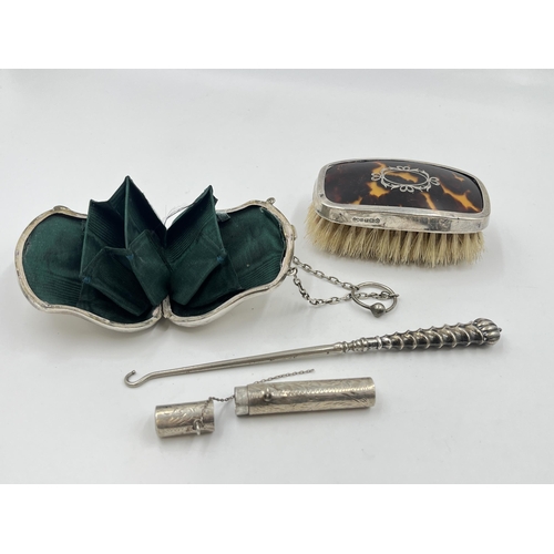 2298 - Four hallmarked sterling silver vanity items to include brush, purse etc. - approx. gross weight 133... 