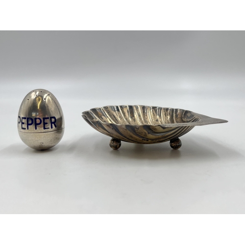 2303 - Two pieces of hallmarked sterling silver, one scallop dish and one pepper pot - approx. gross weight... 