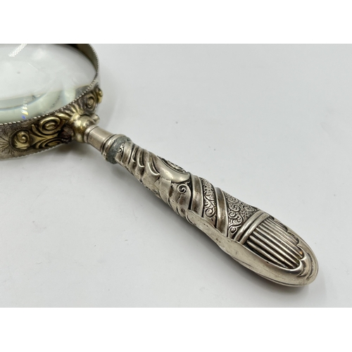 2307 - A silver handled magnifying glass - approx. gross weight 145g and 18cm long