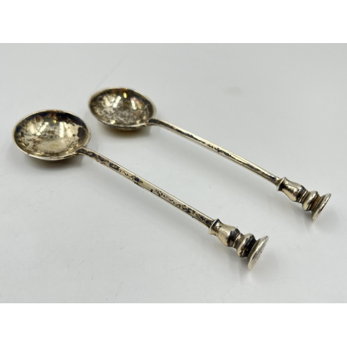 2311 - Two George V Asprey & Co hallmarked London silver spoons, dated 1932 - approx. gross weight 50g and ... 