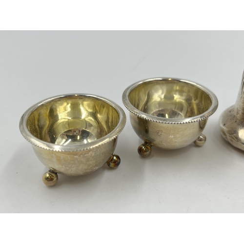 2314 - Four pieces of hallmarked sterling silver, two Victorian Birmingham salt cellars, dated 1886 and two... 