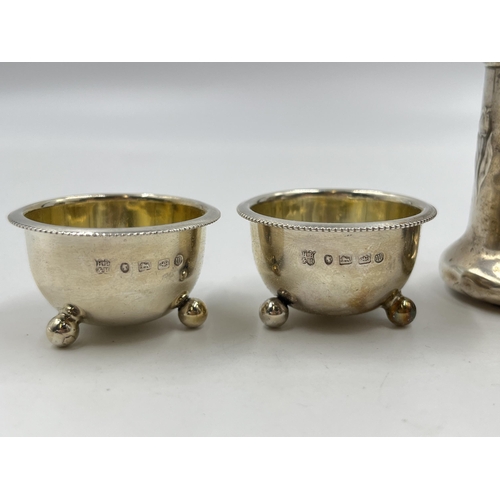 2314 - Four pieces of hallmarked sterling silver, two Victorian Birmingham salt cellars, dated 1886 and two... 