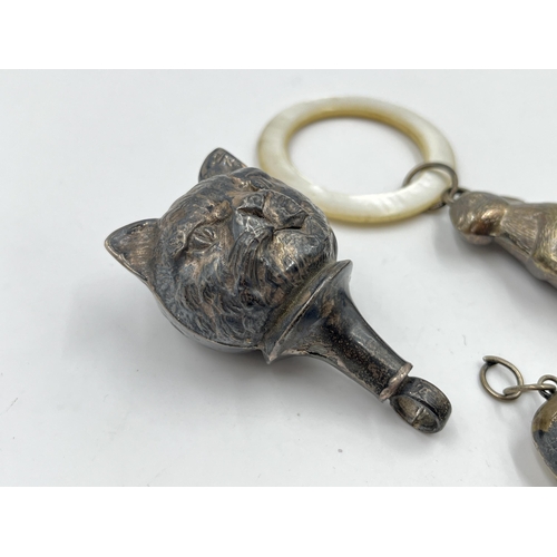 2317 - Three hallmarked sterling silver items, two rattles and one pet bell tag - approx. gross weight 44g